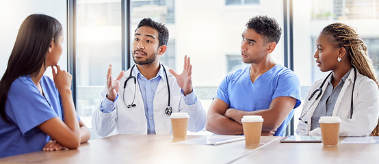 Image showing Meeting, coaching and healthcare with a doctor and team in a hospital boardroom for training or discussion. Teamwork, leadership or learning with a medicine professional talking to nurses in a clinic