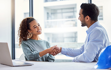 Image showing Handshake, construction worker and woman or partner for business success, partnership or engineering deal in office. B2b, onboarding and architecture contractor or happy people shaking hands for job