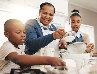 Image showing Black family, grandmother teaching kids baking and learning cooking skill in kitchen with help and support. Old woman with girl and boy, development with growth and bake with ingredients at home