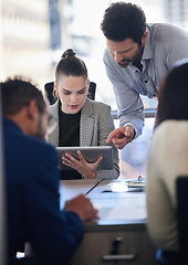 Image showing Digital tablet, collaboration and team doing research together in a meeting in the office. Technology, professional and business people working on a corporate project in the workplace boardroom.