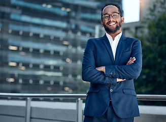 Image showing Portrait, business man and lawyer with arms crossed in city for career or job. Face smile, glasses and male professional, entrepreneur or attorney from India with confidence, pride or success mindset