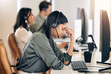 Image showing Call center, stress and woman tired at computer for customer service, crm or telemarketing. Consultant or agent person with depression, headache and burnout for sales, contact us or help desk support