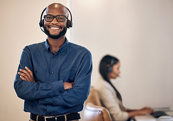 Image showing Call center, smile and black man with headset for customer service, crm or telemarketing support. Portrait of african person, consultant or agent with arms crossed for sales, contact us or help desk