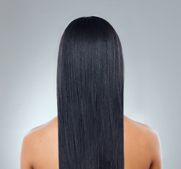 Image showing Hair care, back of woman with straight hairstyle and studio backdrop with healthy keratin treatment. Long haircare, growth and style, model with beauty shine and glow on white background from behind.