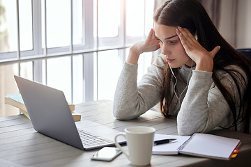 Image showing Laptop, stress and learning with a student woman feeling burnout while studying alone in her home. Education, headache and tired with a young female university or college pupil in her house to study