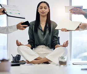 Image showing Meditation, woman at desk surrounded by work and relax with project deadline, time management and mental health. Zen, peace and meditate for balance, businesswoman in busy office in lotus position.