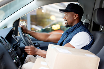 Image showing Delivery man, transport and man driving with a smile for shipping or courier service. Happy black person or driver with cardboard box, package or parcel in a van, cargo vehicle or transportation