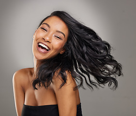 Image showing Hair, smile and portrait of happy woman in studio for cosmetics, treatment and shine on grey background. Happy, face and haircare for female model with volume, texture and keratin result satisfaction