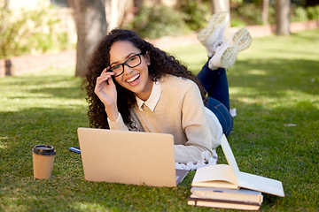Image showing Portrait of happy woman with laptop and notes in park for education, studying in nature and learning online. Smile, research and university student on campus grass with computer and books for project