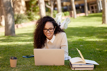 Image showing Woman with laptop and notes studying in park for education in nature to relax and learning online. Smile, research and happy university student in campus garden with computer and books for project.
