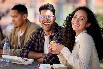 Image showing Students, happy and friends eating lunch together on university or college campus for a break as a group. Smile, portrait and group of young people with food, burger or relax in a restaurant