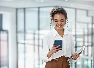 Image showing Business, woman and reading on mobile phone with tablet at the office with a smile for online communication. Female professional, technology and typing at a company for conversation on the internet.