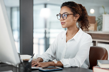 Image showing Professional woman at desk, working at computer with email and writing article at digital marketing agency. Focus, web design and typing at desktop PC with female copywriter, notes and SEO content