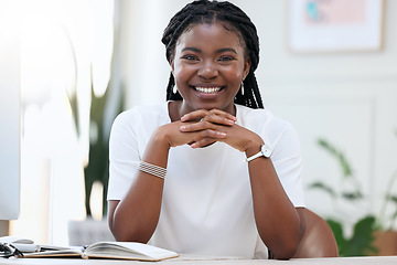 Image showing Portrait of confident black woman at desk with smile, notebook and online research for small business administration. African businesswoman in office with pride planning schedule, proposal or report.