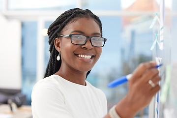 Image showing Writing, face and black woman with happiness at board planning a business analyst project. African female person, portrait and professional with staff notes and moodboard working on company data