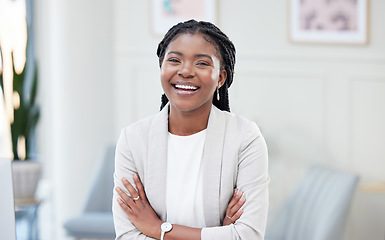 Image showing Confidence, crossed arms and portrait of a businesswoman in the office with leadership and success. Happy, smile and professional African female corporate ceo standing with vision in her workplace.