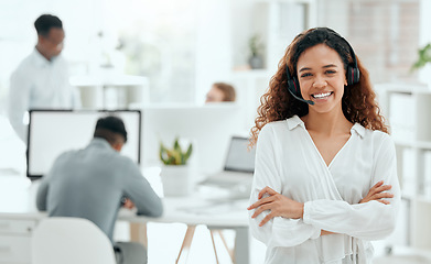Image showing Call center woman, confident portrait and office with arms crossed, leader and pride with team in blurred background. Telemarketing manager, happy and smile for customer service, tech support or crm