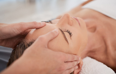 Image showing Spa, relax and hands with a head massage for facial wellness, luxury therapy and sleep. Skincare, health and a masseuse massaging temple of a woman at a salon for reflexology and acupressure