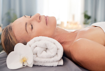 Image showing Relax, massage and woman with luxury, spa and wellness with grooming, stress relief and pamper treatment. Female person, mature customer and client on a bed, body care and resort for peace and health