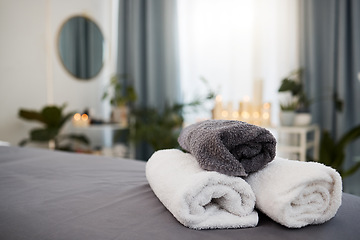 Image showing Towel, bed and spa background for wellness, luxury and health industry with candle bokeh for calm or peace. Massage, hotel and room for holiday or vacation, interior design and hospitality services