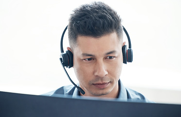 Image showing Man, face with callcenter and phone call, CRM and headset for communication, technology and contact us. Customer service, telemarketing or tech support with male consultant and help desk worker