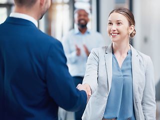 Image showing Thank you, coworkers shaking hands and at office of their work together. Partnership or support, crm or agreement and cheerful colleagues with a handshake for greeting at their modern workplace