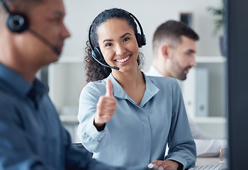 Image showing Woman at callcenter, thumbs up in portrait and CRM, communication of support and agreement emoji. Contact us, customer service and tech, female agent with headset and smile, success and thank you