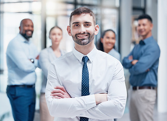 Image showing Smile, business people in portrait with team leader and confidence at project management company. Teamwork, commitment and vision, happy team with manager and arms crossed in corporate startup office