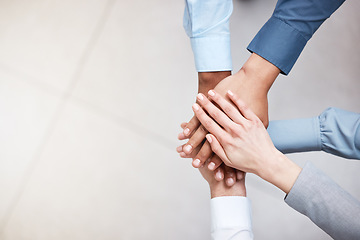 Image showing Hands, mockup and a business team in a huddle from above for support, motivation or solidarity. Collaboration, teamwork and space with a group of people or colleagues standing in a circle at work