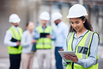 Image showing Business woman, architect and tablet in leadership, project management or inspection for construction on site. Female person, engineer or manager with technology and team for industrial architecture