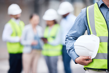 Image showing Businessman, architect and helmet for safety in construction, project management or meeting on site. Man holding hard hat for industrial architecture, teamwork or maintenance and building in the city