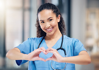 Image showing Happy woman, doctor and portrait with heart hands for love in healthcare or life insurance at the hospital. Female person or medical professional showing hand loving emoji, symbol or sign at clinic