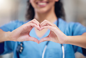 Image showing Happy woman, doctor and heart shape hands for love in healthcare or life insurance at the hospital. Female person or medical professional showing hand loving emoji, symbol or sign gesture at clinic