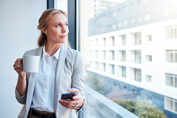 Image showing Thinking, coffee and woman with a phone at work for a break, social media or a vision at window. Office, ideas and a corporate employee with tea and a mobile for an app, chat or email in the morning