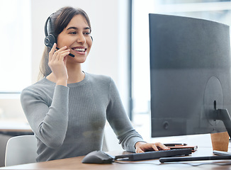 Image showing Consultant, woman with headset and on a computer at her desk in a workplace office. Telemarketing or customer service, crm or client support and online communication with female person at workspace