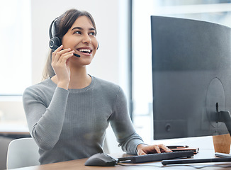 Image showing Customer service, woman with headset and on a computer at her desk in a workplace office. Call center or consultant, crm or client support and telemarketing with female person at her workspace