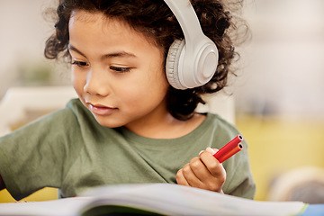 Image showing Music, headphones and relax with child and art for learning, education and writing. Learning, streaming and drawing with young boy student and notebook at home for audio, creative and kindergarten