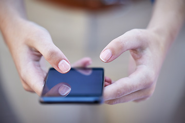 Image showing Hands, phone and communication with a woman typing a text message closeup on a blurred background. Mobile, networking and social media with a female person reading a text or browsing alone outdoor