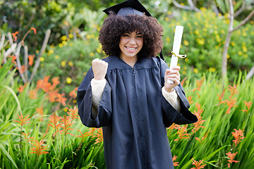 Image showing Graduation, celebrate and portrait of woman student or graduate with achievement on university or college campus. Happy, happiness and person with a certificate, scholarship or diploma from education