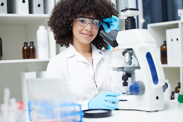 Image showing Happy woman, portrait and scientist with microscope for research, testing or experiment in pharmaceutical lab. Female person with smile for scientific search, discover or cure in science laboratory