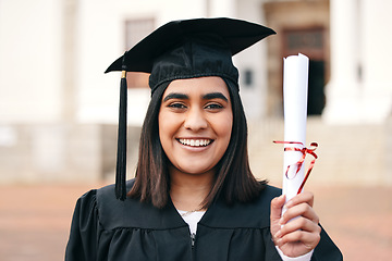 Image showing Diploma, certificate and portrait of a woman graduate with success or achievement on college or university campus. Graduation, happy and young person or student with an education scholarship