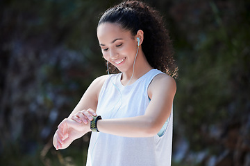 Image showing Smart watch, fitness and woman in nature for exercise, training and workout while listening to music. Sports, motivation and happy female person check time for heart rate, wellness and performance