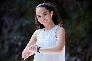 Image showing Smart watch, fitness and portrait of woman in nature for exercise, training and workout with music. Sports, motivation and happy female person check time for heart rate, wellness and performance