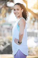 Image showing Happy woman, portrait smile and runner in fitness, workout and cardio exercise in the nature outdoors. Fit, active or sporty female person smiling for running, exercising or training in the park