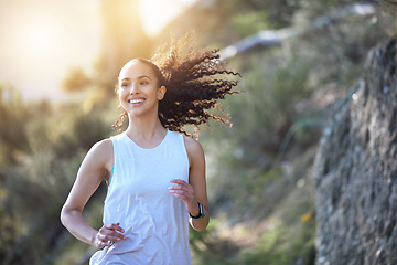 Image showing Happy woman, running and smile in forest for fitness, workout or cardio exercise in the outdoors. Fit, active or sporty female person or runner smiling for healthy wellness, run or training in nature