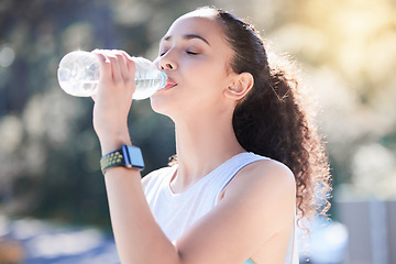 Image showing Woman, fitness and drinking water in nature for sustainability after workout, running or exercise. Fit, active and thirsty female person or runner with drink for hydration, rest or break outdoors