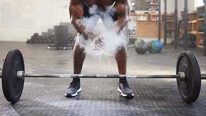 Image showing Fitness, training and a man with powder for weightlifting, strength exercise and bodybuilding. Sports, challenge and a bodybuilder with gym chalk for a workout with weight and getting ready to lift