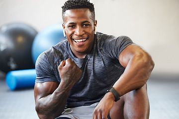 Image showing Fitness, cheering and portrait of man in a gym after success or complete workout. Sports, motivation and African male athlete with fist pump for bodybuilding or strength arm exercise in sport center.