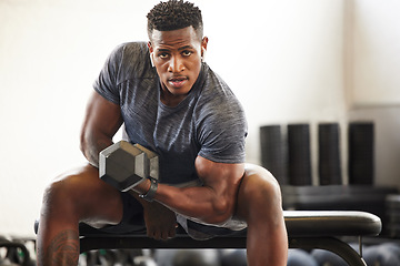 Image showing Black man, bodybuilder and dumbbell in gym portrait for fitness, focus or training for growth, goal or competition. African guy, weightlifting and strong arms for training, wellness and muscle health