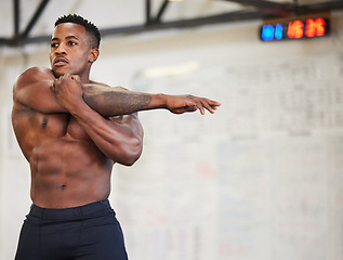 Image showing Shirtless black man, stretching arms and fitness in gym with muscle, strong and abs with workout and mockup space. Focus, serious male athlete and bodybuilder, warm up and ready for exercise